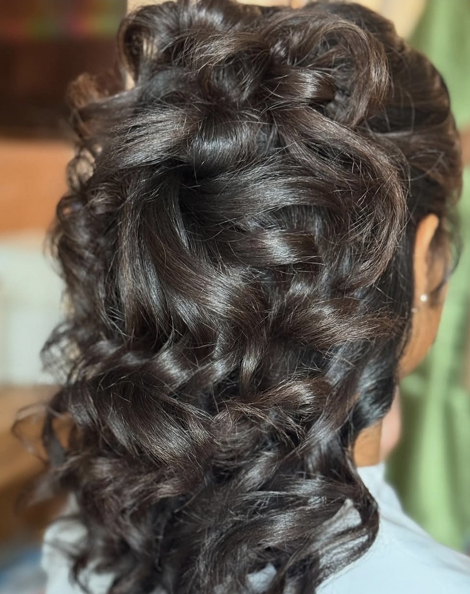 Curled updo styled for a wedding